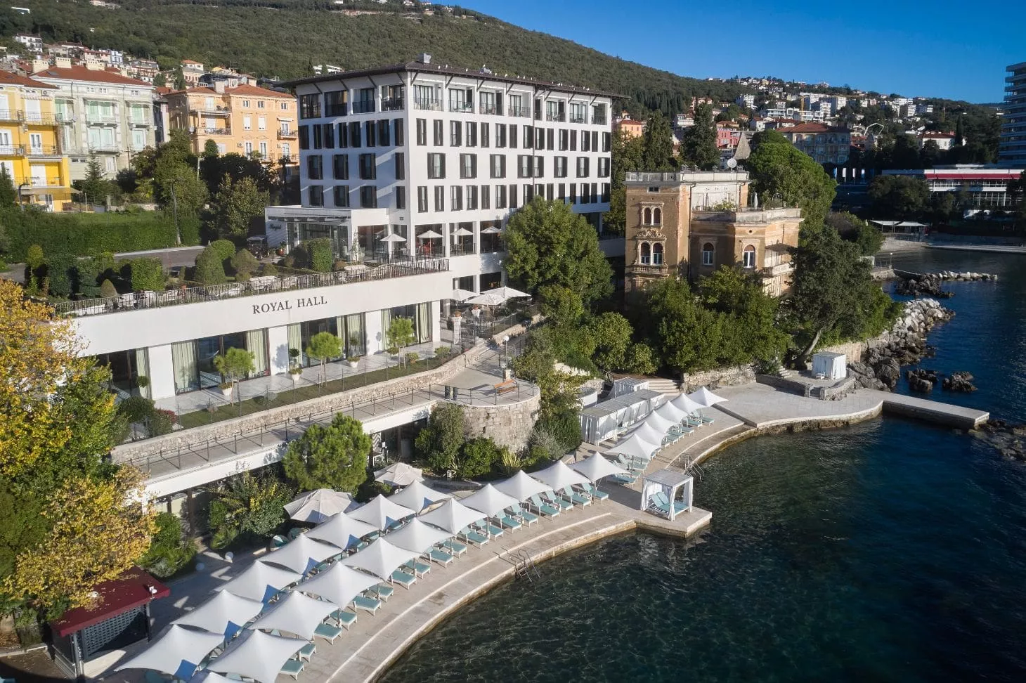 Aerial view of Hotel Royal Opatija, Royal Hall and Royal Beach on the Adriatic coast with elegant seaside terraces and crystal-clear sea.