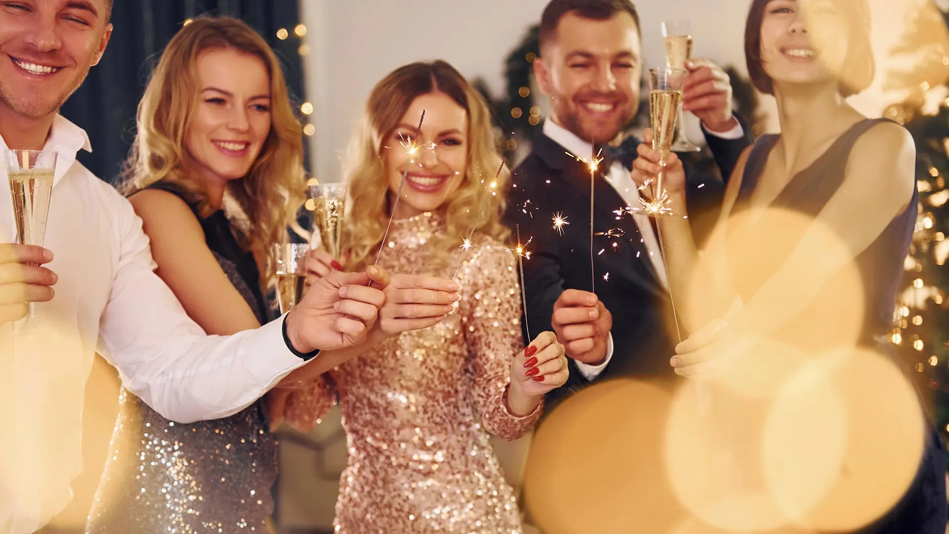 with-sparklers-hands-group-people-have-new-year-party-indoors-together.jpg